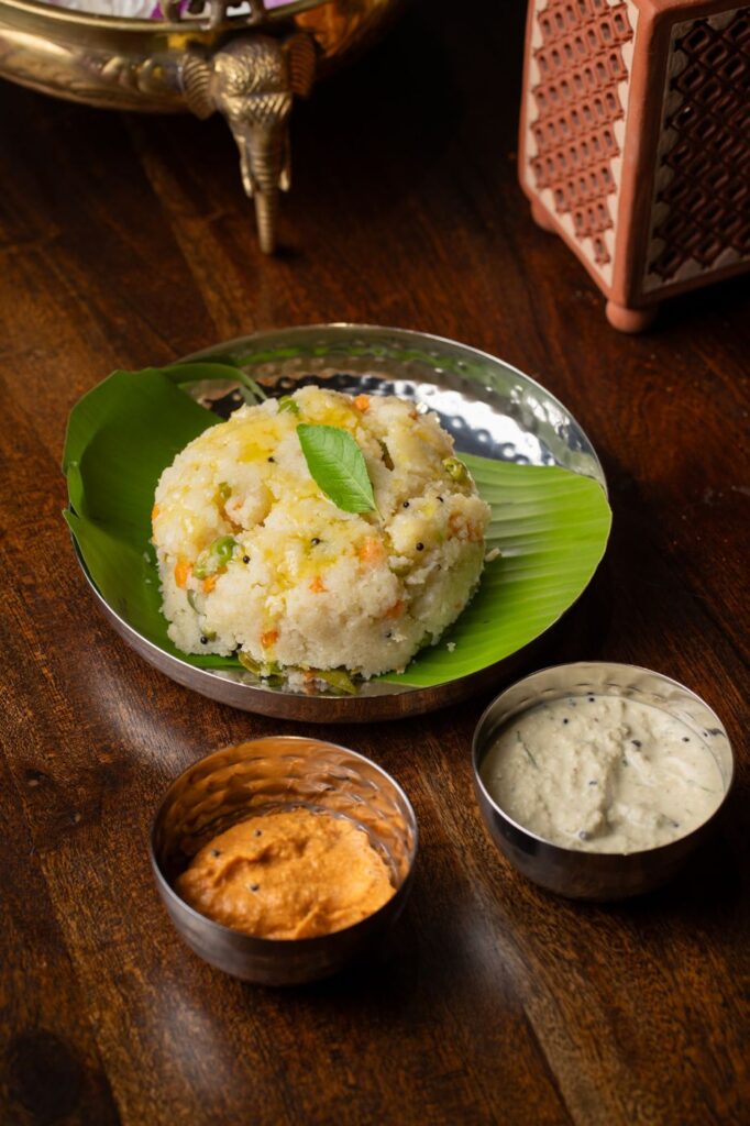 A mound of vegetable khara bath on a banana leaf