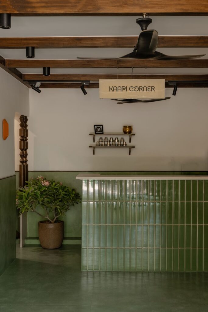 The Kaapi Corner sign above the green tiled coffee counter at Benne & Brew, Viman Nagar