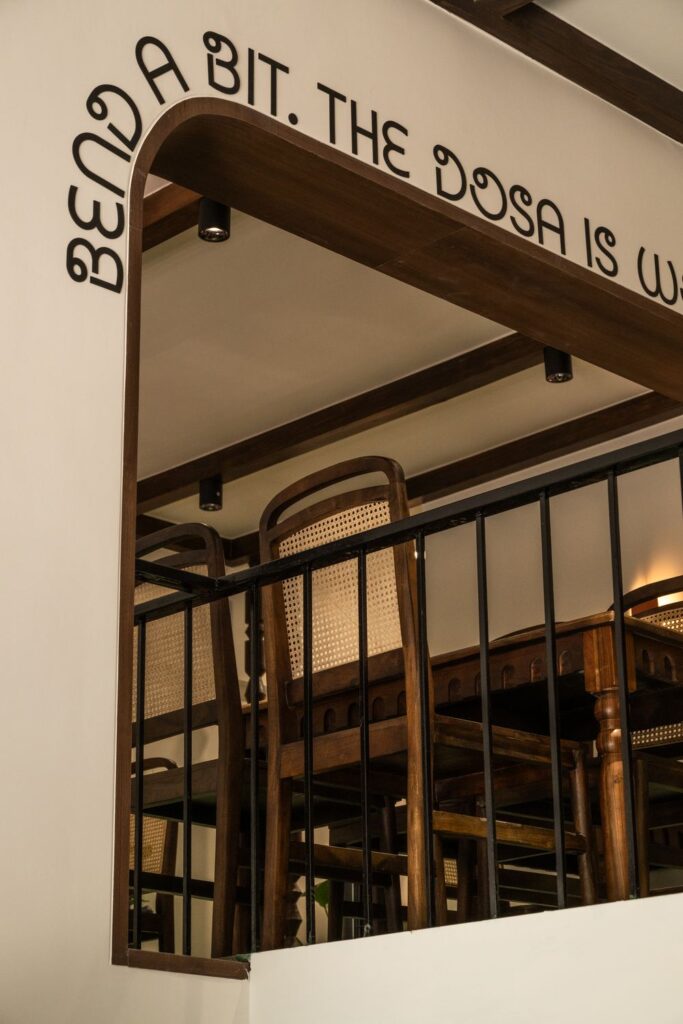 The arched opening into the upstairs dining room at Benne & Brew, under the wall line Bend a bit, the dosa is worth it